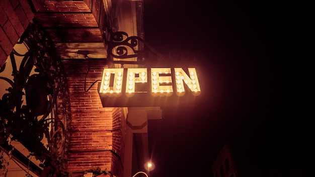 Free Photo a low angle shot of an open sign made with lights