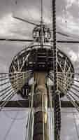 Free photo low angle shot of a ship's main mast under the cloudy sky