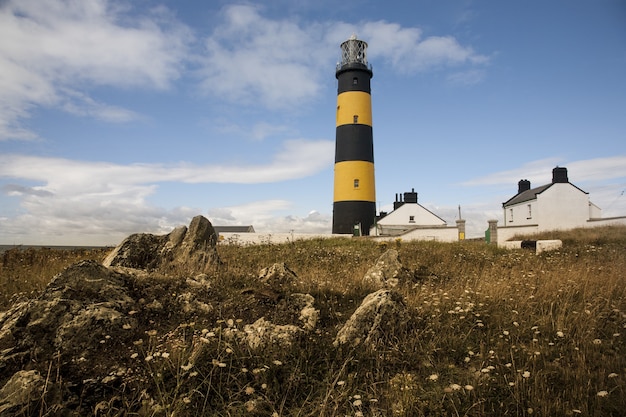 Low angle shot of the St John's Point lighthouse in Killough on Dundrum Bay in Northern Ireland