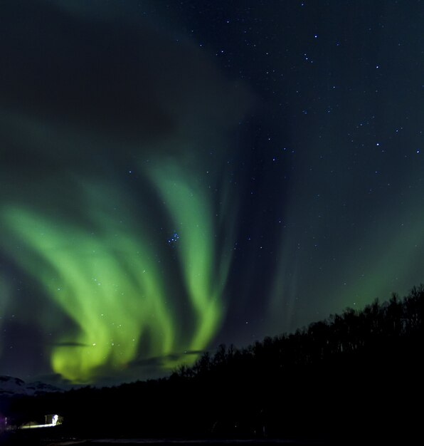 Low angle sot of green Aurora Borealis in Norway