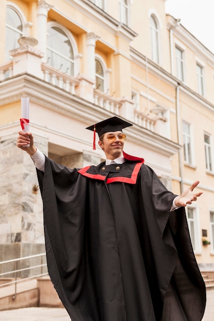 Free Photo low angle student celebrating