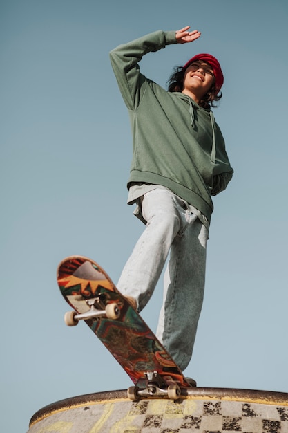 Low angle of teenager at the skatepark having fun