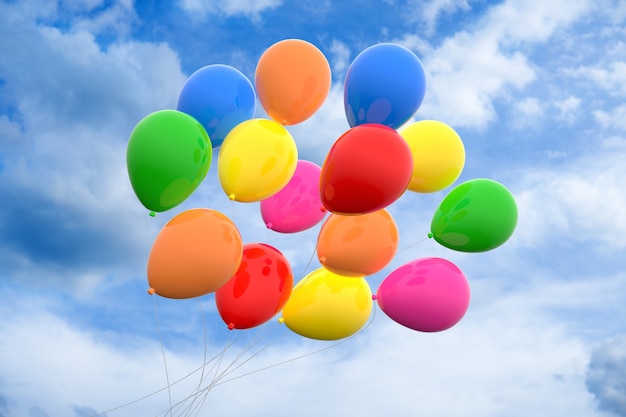 Low angle view of colorful balloons under a cloudy sky at daytime