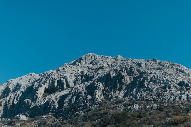 Low angle view stony mountain