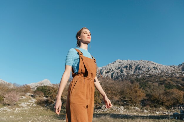 Low angle view woman walking looking forward