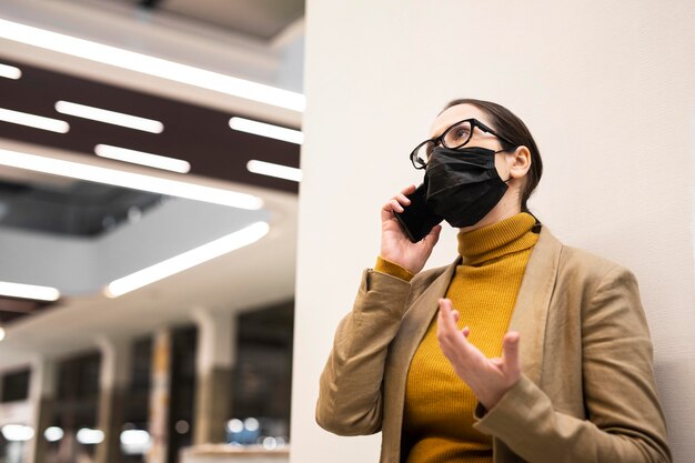 Low angle woman talking on phone