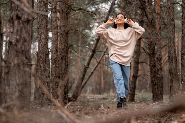 Low angle woman with headphones