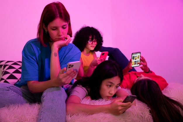 Low angle women with smartphones