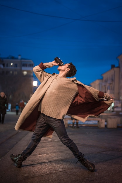 Low angle young man dancing ballet