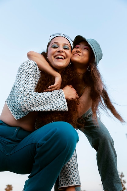 Low angle young women posing together