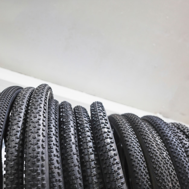 Free Photo low section view of black bicycle tires in workshop