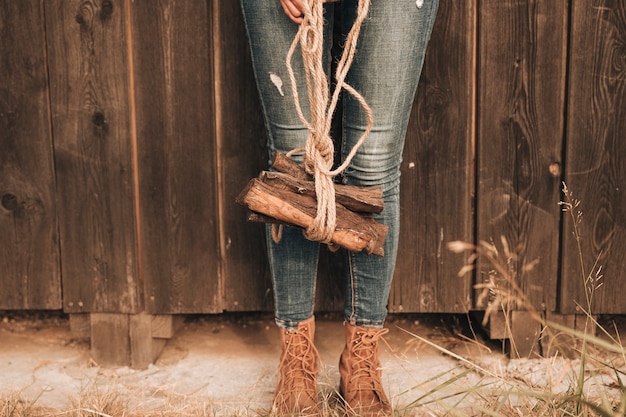 Low view woman carring fire wood