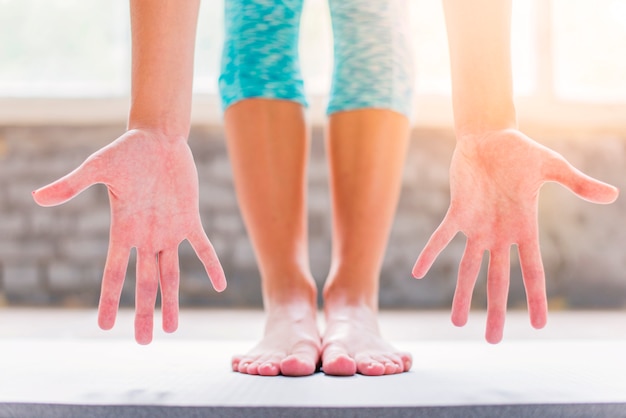 Lowsection view of a woman showing her palm