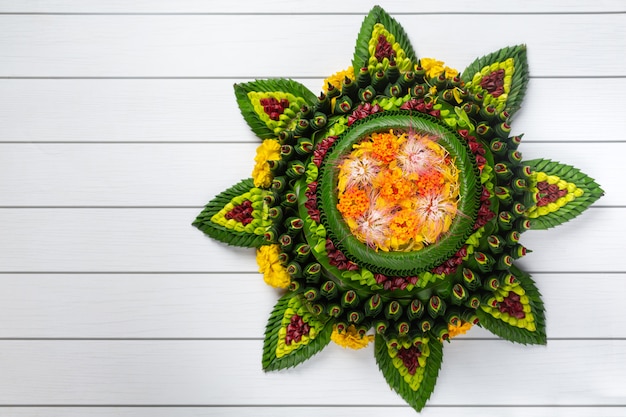 Free photo loy krathong festival. decorated buoyant put on white wooden background