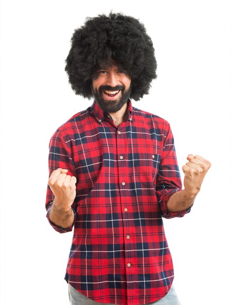 Lucky afro man over white background