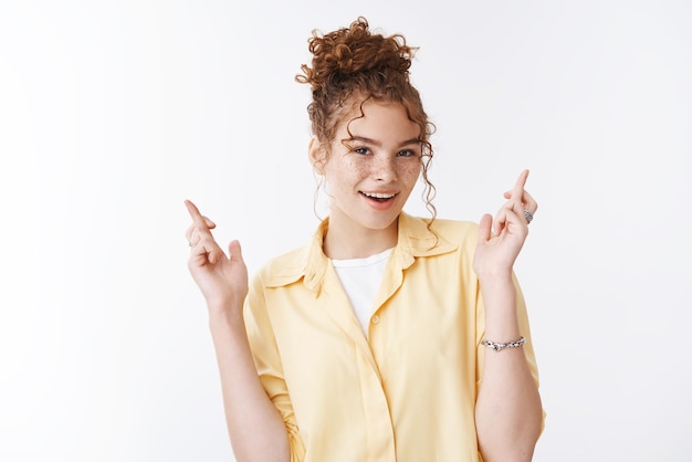 Lucky positive good-looking female cross fingers make wish smiling optimistic