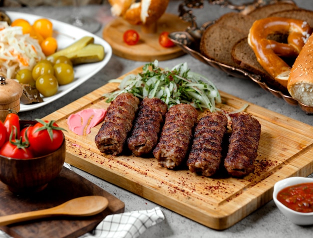 Lule kebab with onions and pickles