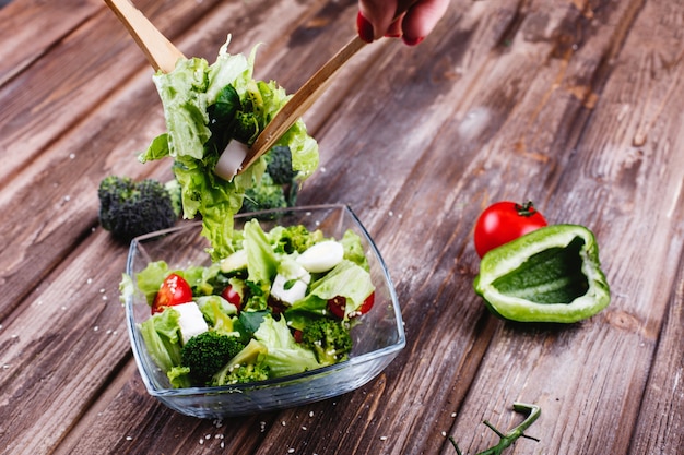 Free photo lunch or dinner ideas. fresh salad of greenery, avocado, green pepper, cherry tomatoes