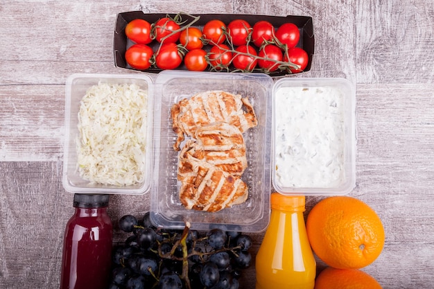 Free photo lunch packed in different boxes. fresh and healthy eating on wooden background