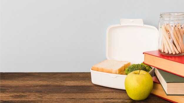 Lunchbox laying on wooden table