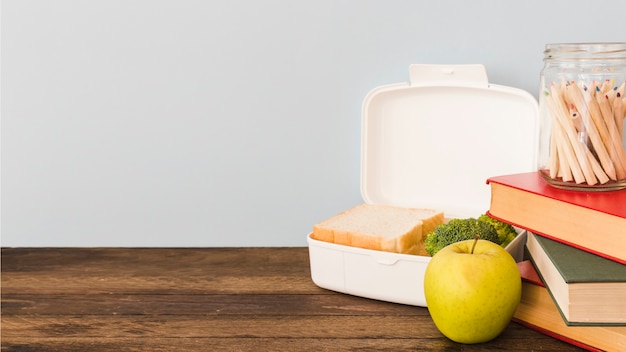 Lunchbox laying on wooden table