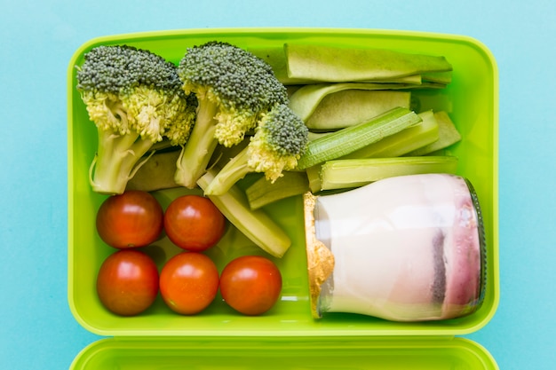 Lunchbox with yogurt and vegetables