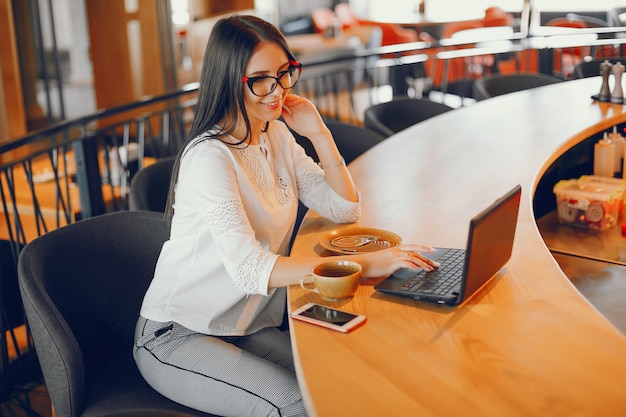 luxury girl sitting in a restaurant