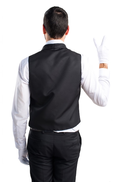 Luxury waiter doing victory gesture