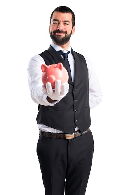 Free photo luxury waiter holding a piggybank