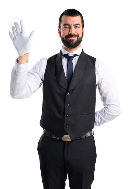 Free photo luxury waiter saluting