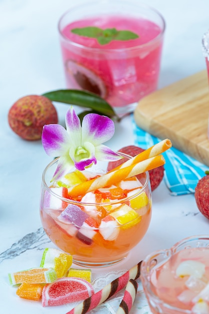 Free photo lychee jelly, seasonal fruit and beautifully decorated thai dessert concept.