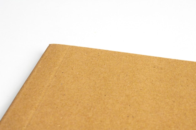 Free photo macro of blank notebook corner with cardboard hardcover isolated on white