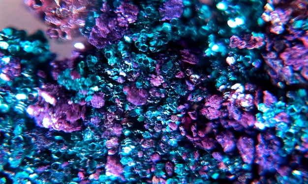 Free photo macro photography of a background with brightly colored glitter