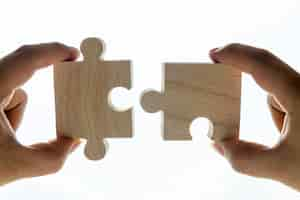 Free photo macro shot of jigsaw puzzles teamwork concept