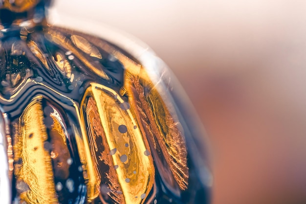 Free Photo macro shot of a silver christmas ball on a blurred background