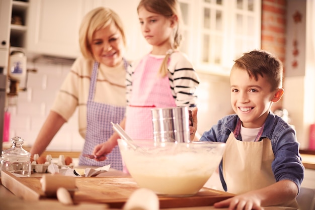 Free Photo main view of boy with kitchen accessories