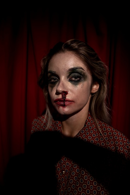 Free photo make-up blood running down from woman face