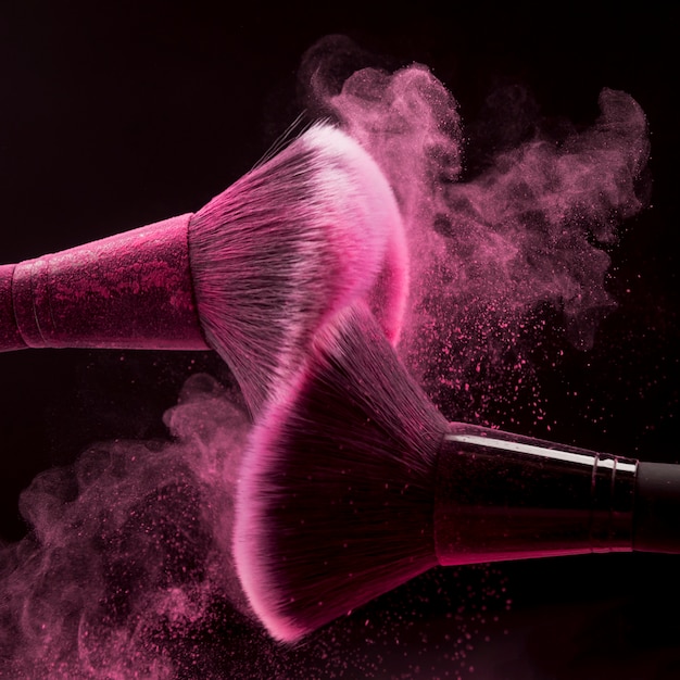 Makeup brushes with pink powder splash