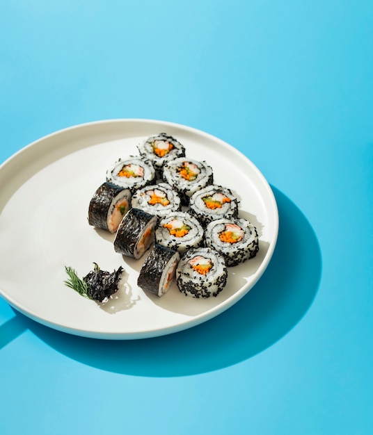 Free photo maki sushi rolls on white plate