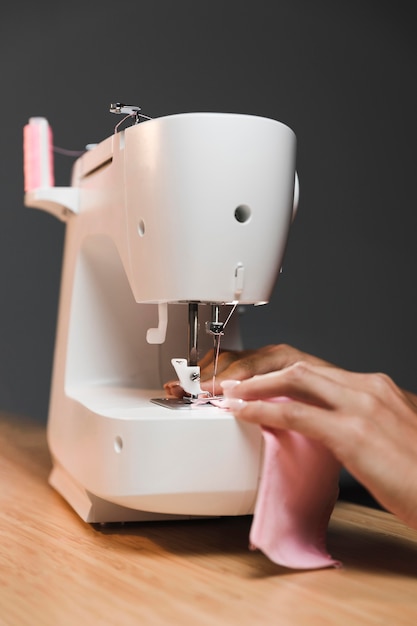 Free Photo making a fabric mask with sewing machine