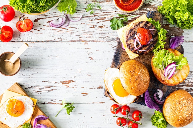 Making homemade burger. Ingredients for cooking on a wooden table.Top view or flat lay. Copy space