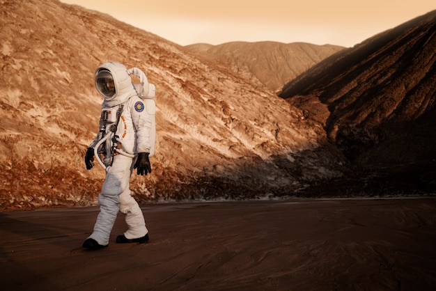 Free photo male astronaut during a space mission on another planet