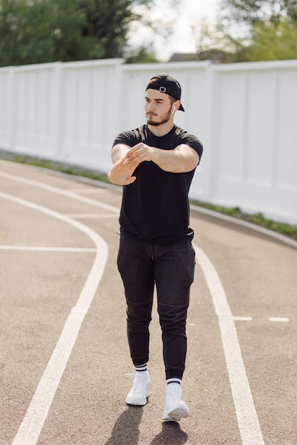 Male athlete doing fitness training. Workout outside the gym.