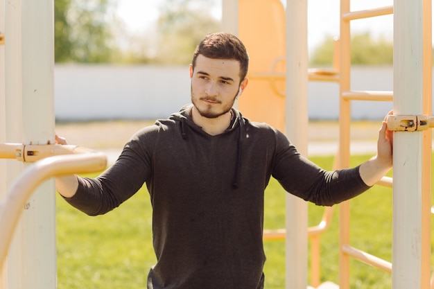 Male athlete doing fitness training. Workout outside the gym.