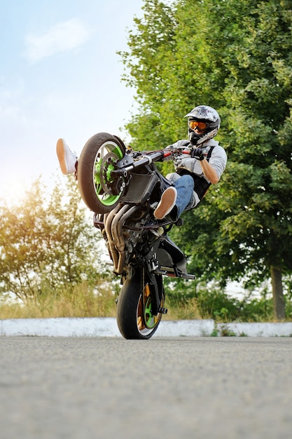 Male biker practicing stunts on a bike