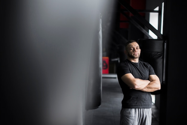 Male boxer posing in t-shirt and shorts