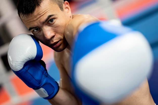 Free Photo male boxer with protective gloves