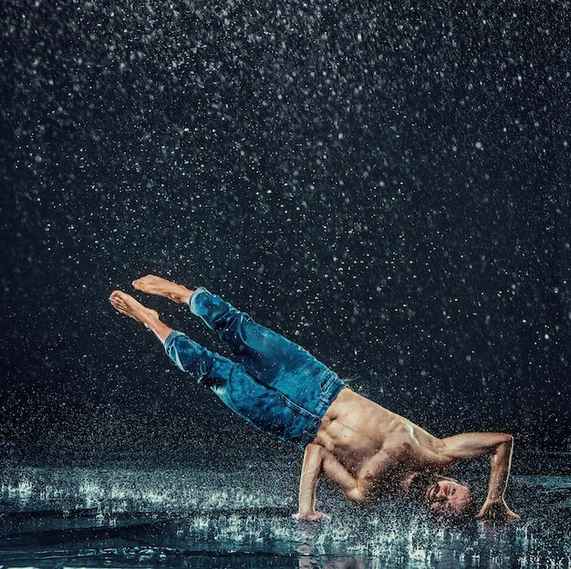 Free photo the male break dancer in water.