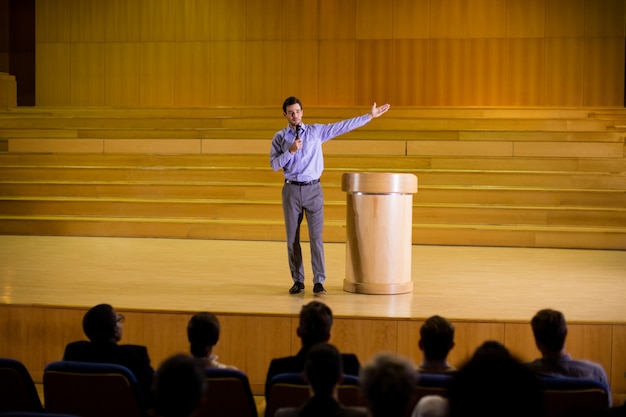 Free Photo male business executive giving a speech