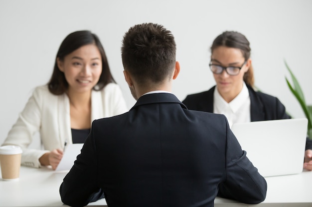 Male candidate interviewed by diverse HR team